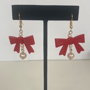 Z56 New (without tags) Costume jewelry- Dangle earrings with red bows.